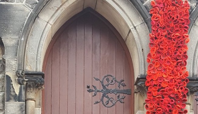 Some of the knitted Poppies adorning the church entrance