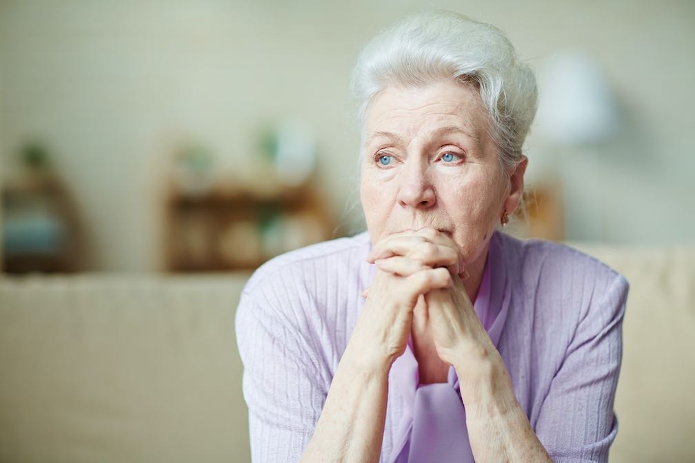 Older person contemplating