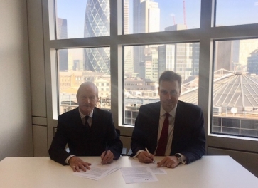 Lord Hunt of Wirral and Andy Briggs sign the agreement